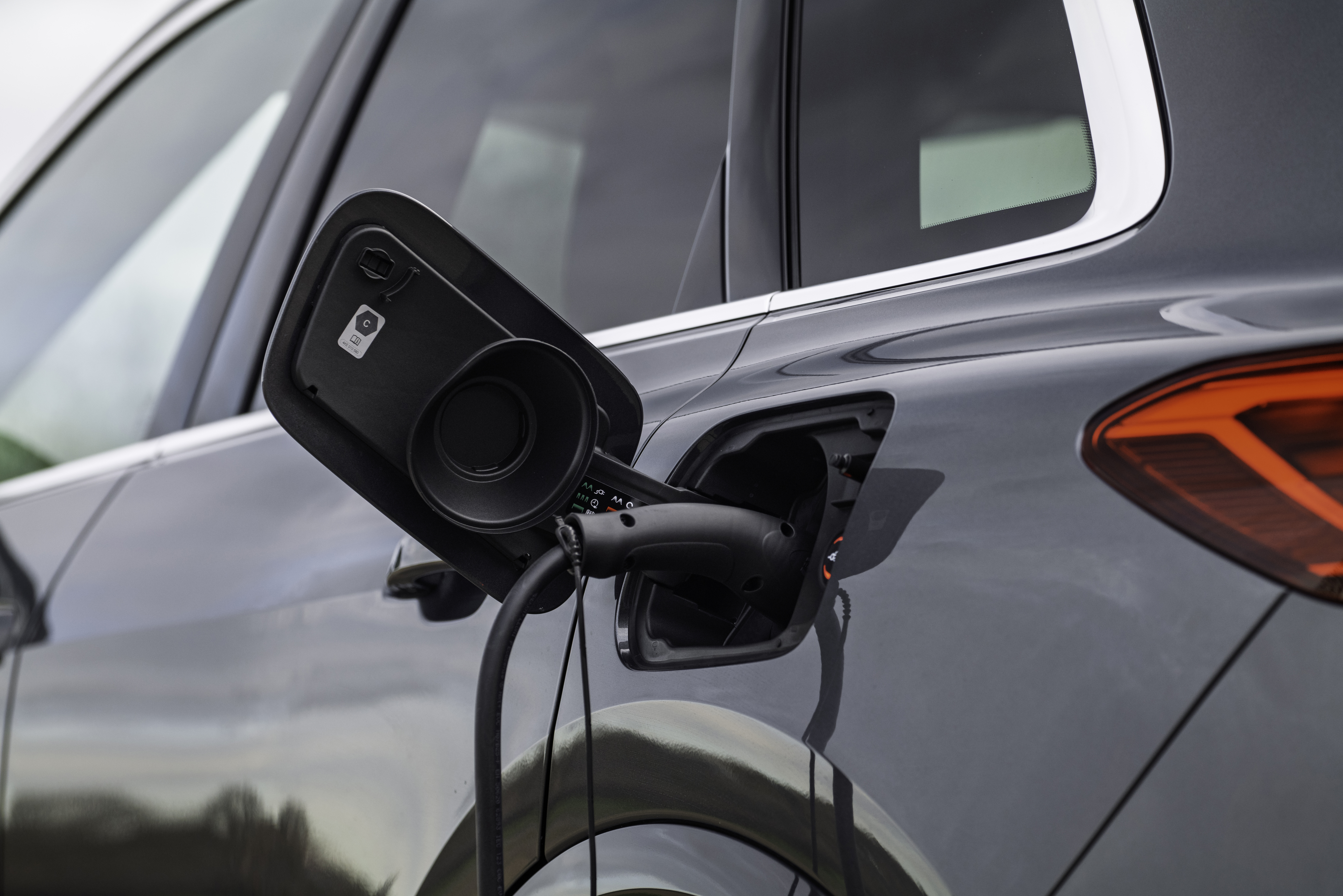 Audi Q5 SUV e-hybrid plugged in charging