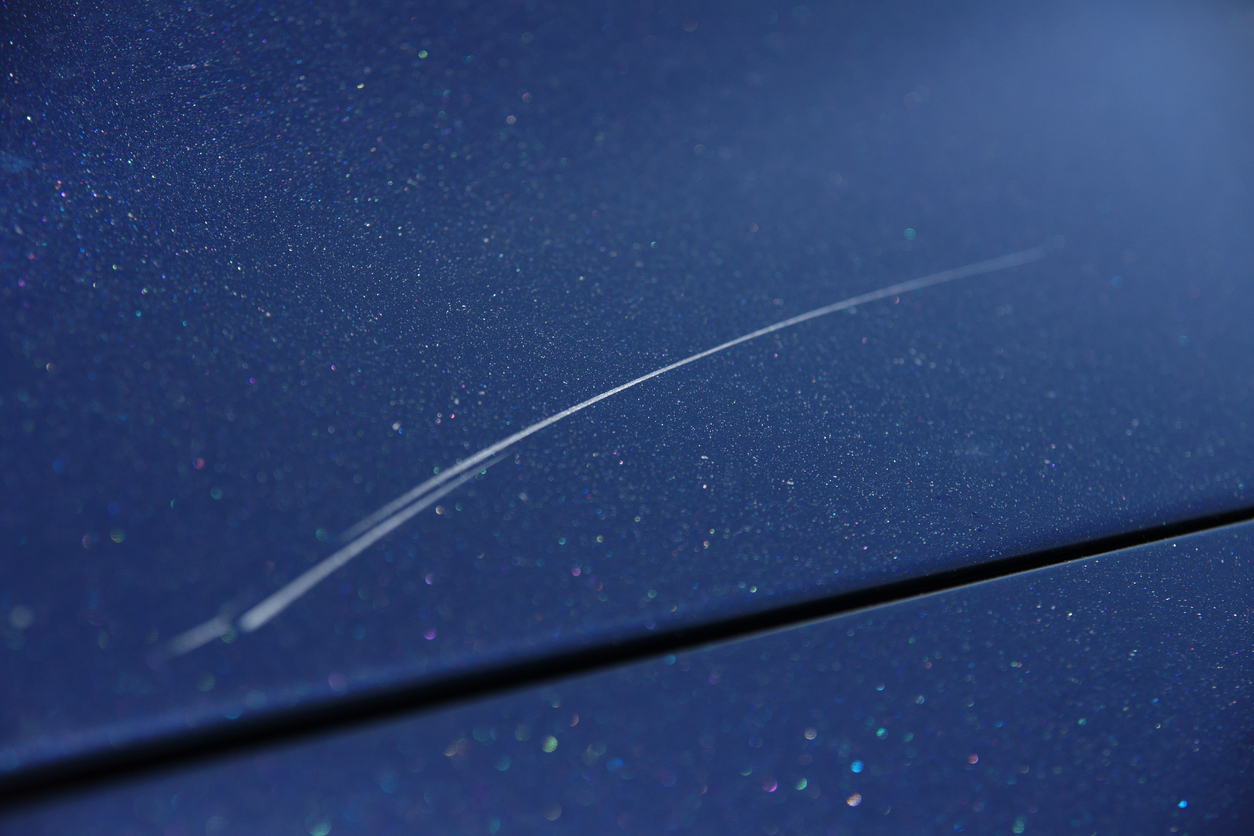 Close-up of a paintwork scratch covered by SMART Insurance for lease cars. 