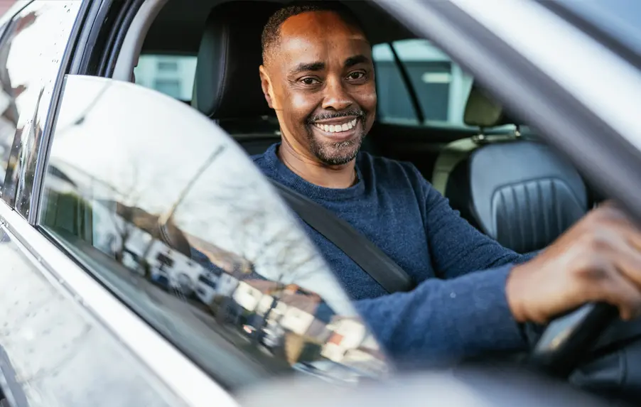 man driving a lease car